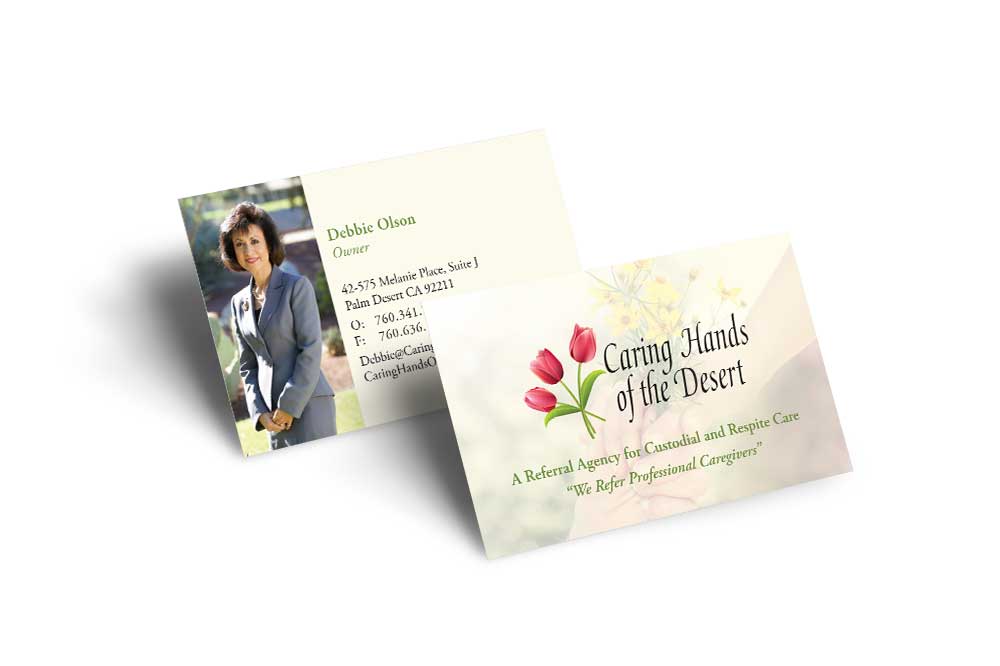 Photo of the front and back of the Caring Hands of the Desert business card.